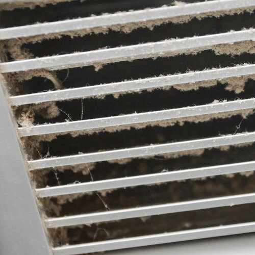 Dirty vent covered in dust.