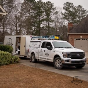 HVAC truck parked in driveway.