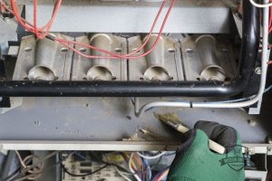 Brushing Away Dust Bunnies in a Furnace