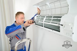 Technician Completing Ductless Air Conditioning Repair